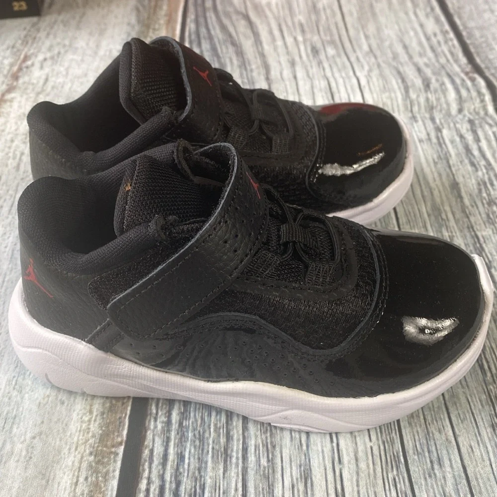 Kids Jordan 11 CMFT LOW Black Sneakers with Red Accents SIZE 8C
